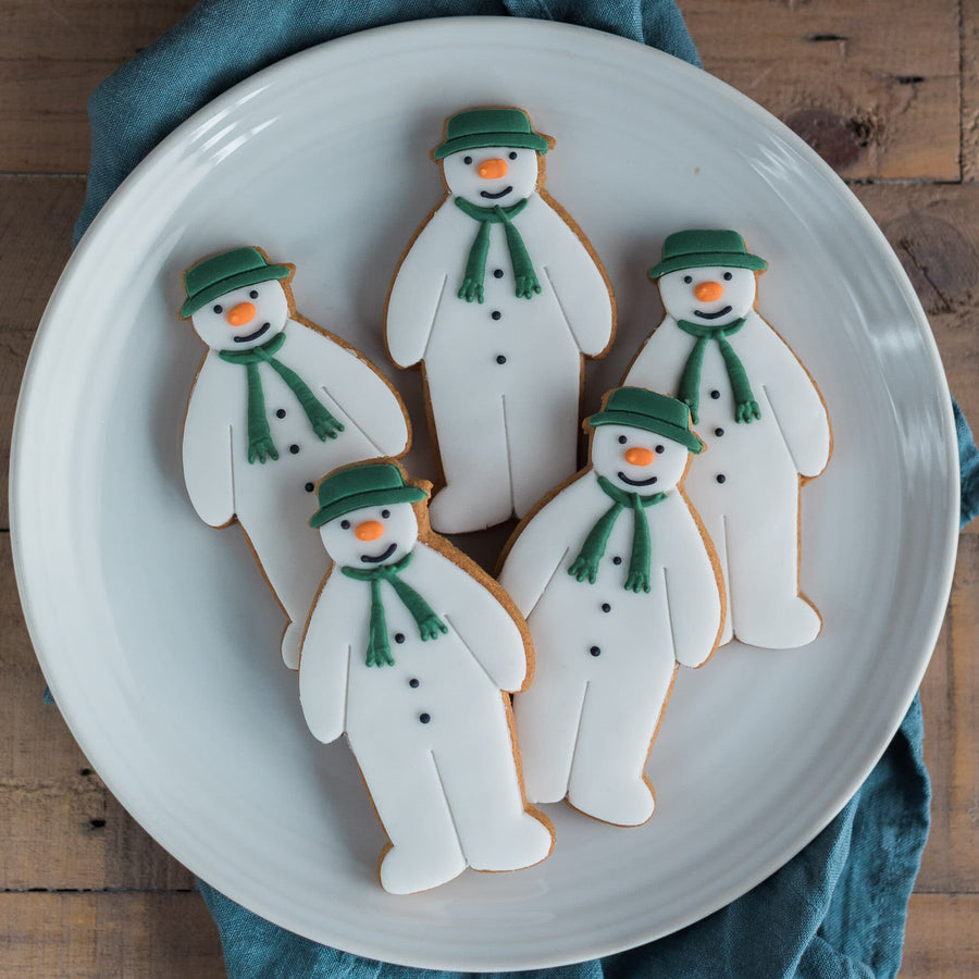 Hand iced snowman biscuits made in the shape of the character from The Snowman film