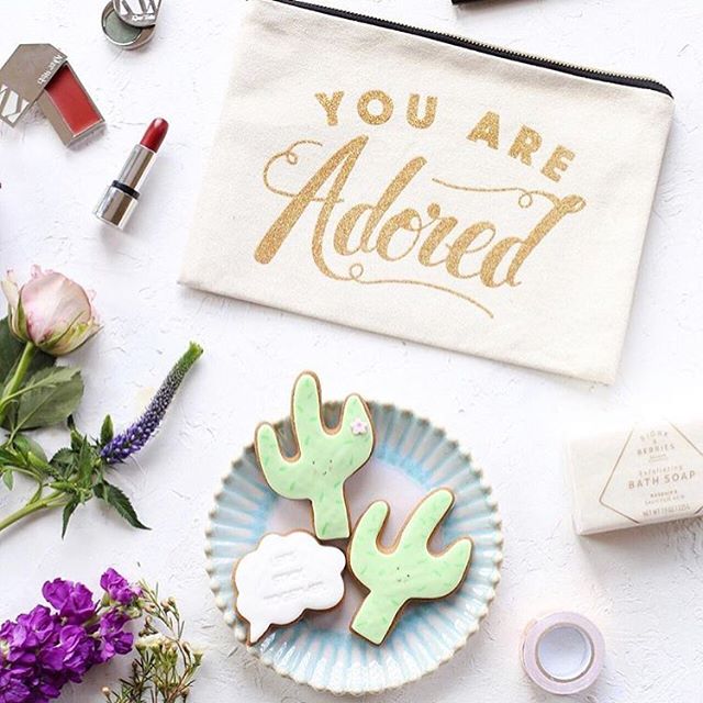 F l a t l a y Loving this flatlay by @iamkristabel. All the heart eyes for the @alphabetbags make up bag!
