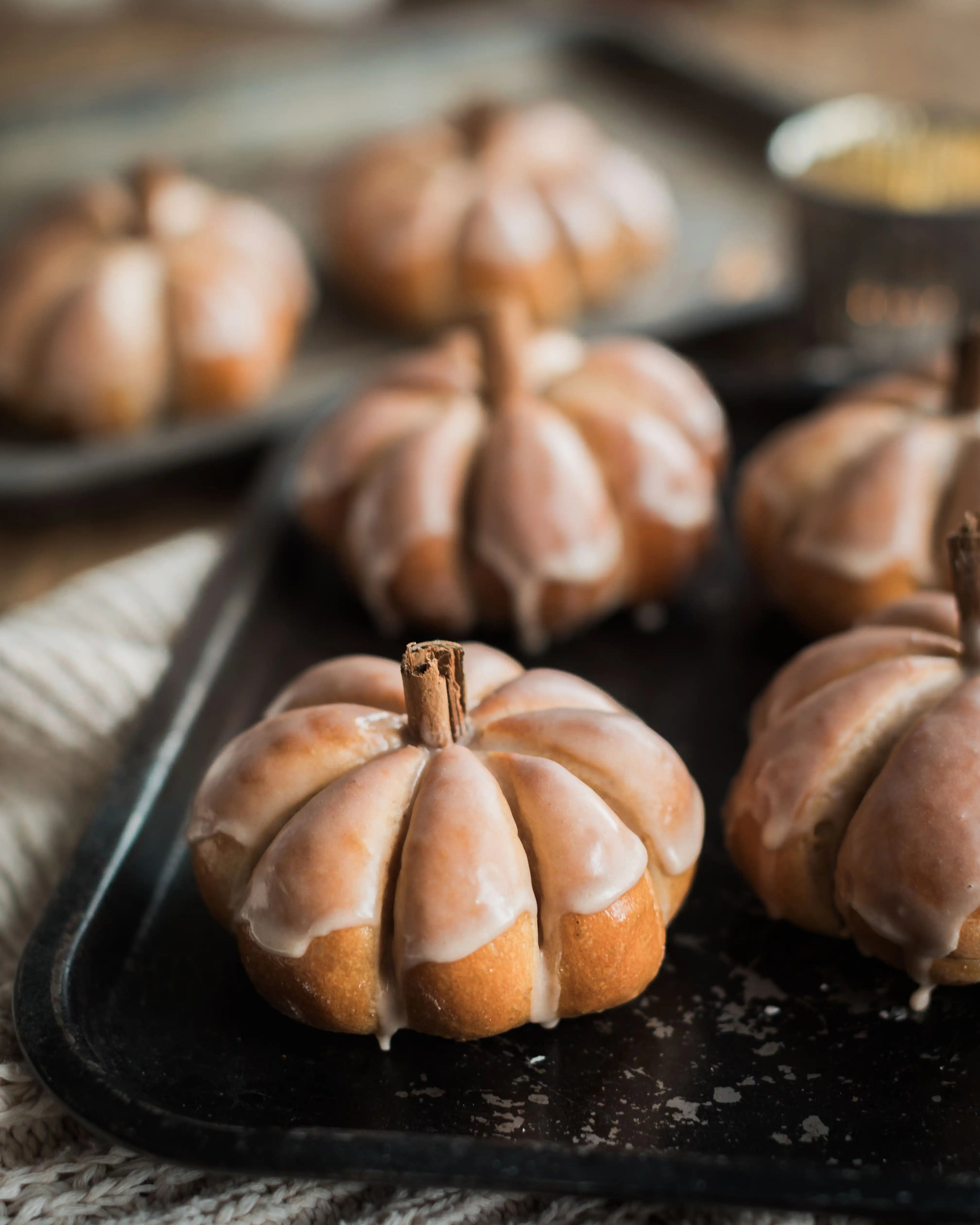 Honeywell Bakes Pumpkin Spiced Iced Bun Baking Kit - Decorative pumpkins with a glaze on a baking tray