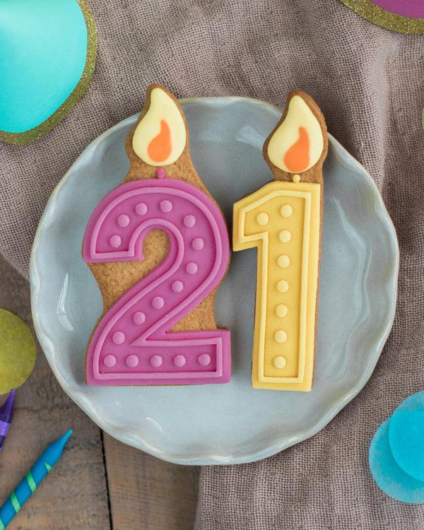 Honeywell Bakes 21st Birthday Biscuits - Number 21 cookies with candles on a plate, resembling birthday candles.