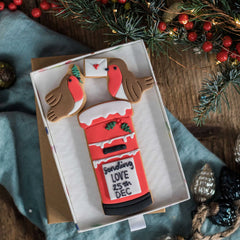 Christmas postbox biscuits, with snow and two robins, one holding a letter