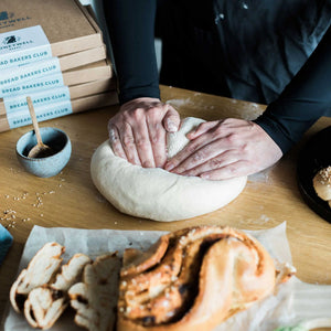 Honeywell Bakes Bread Bakers Subscription, a person kneading dough from their bread baking subscription box