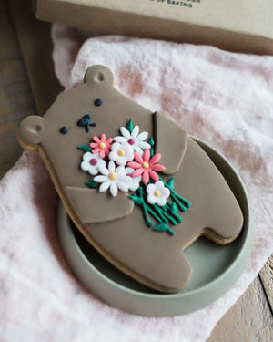 Honeywell Bakes Bunch Of Flowers Biscuit Bear - Cookie shaped like a bear with floral design on a pink surface
