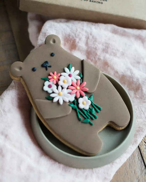 Honeywell Bakes Bunch Of Flowers Biscuit Bear - Cookie shaped like a bear with floral design on a pink surface