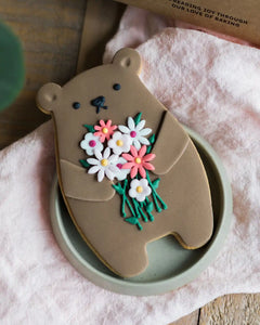 Honeywell Bakes Bunch Of Flowers Biscuit Bear - Cookie shaped like a bear with floral design on a pink surface