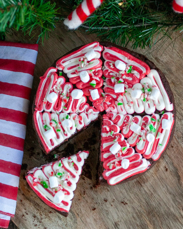 Honeywell Bakes Young Bakers Subscription, A festive cake decorated with candy cane icing