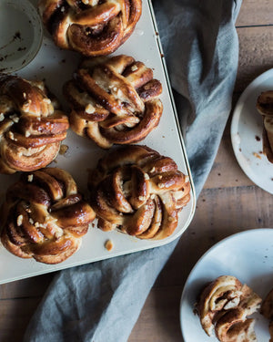 Honeywell Bakes Chocolate & Hazelnut Babka Buns - Baked pastries on a tray with a wooden background