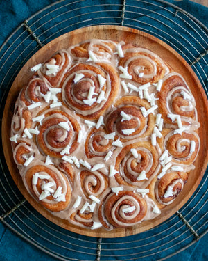Honeywell Bakes Family Bakers Subscription, glazed cinnamon rolls topped with white chocolate shavings
