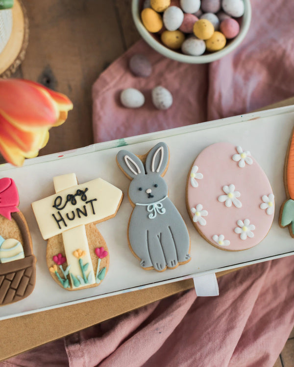 Honeywell Bakes Easter Egg Hunt Biscuit Gift - Easter-themed cookies including a rabbit, egg, and 'easter hunt' sign on a tray.