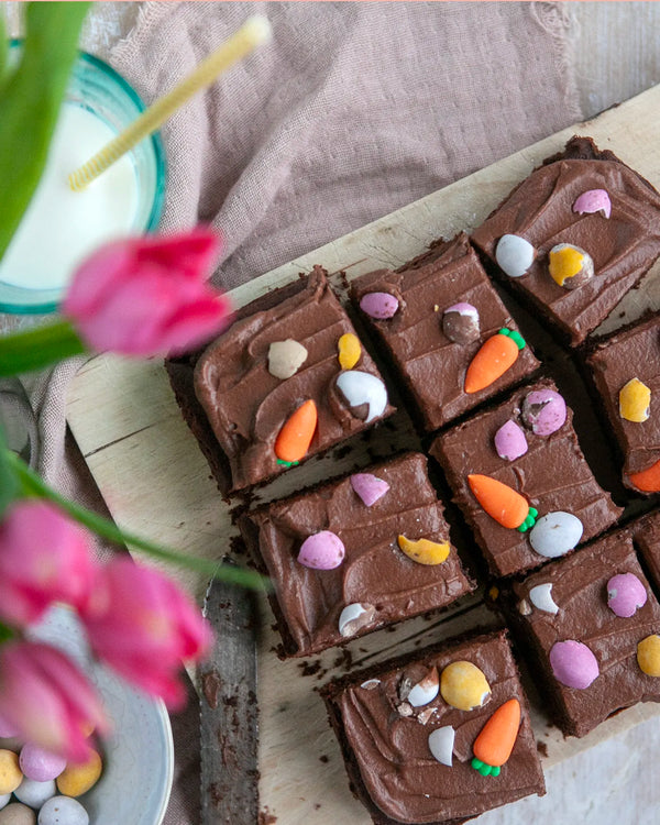 Honeywell Bakes Young Bakers Subscription, a chocolate cake with easter themed edible decorations including mini eggs and icing carrots