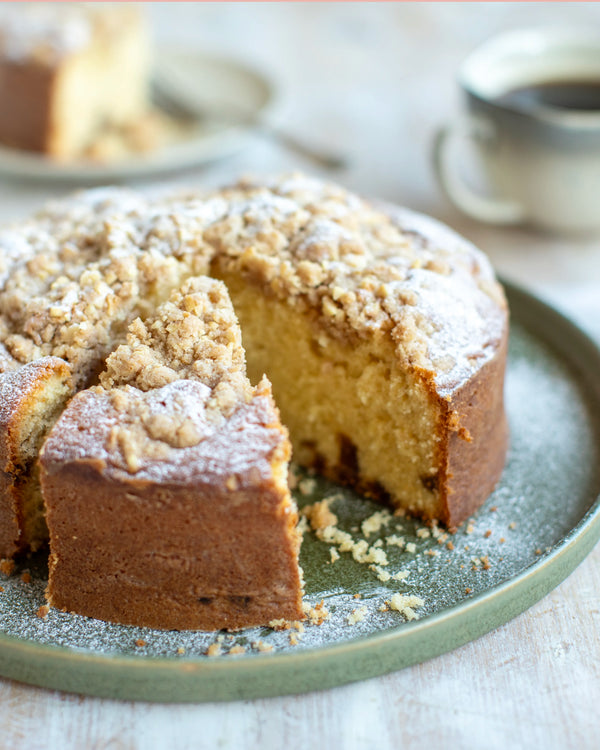 Honeywell Bakes Bakers Club Subscription, A slice of golden-brown fig cake cake with a crumb streusel topping 