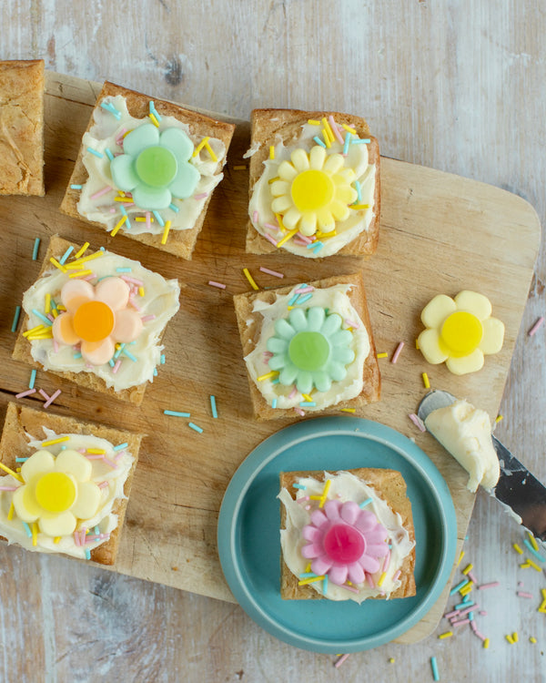 Honeywell Bakes Young Bakers Subscription, cheerful blondie with flower shaped sweet decorations 