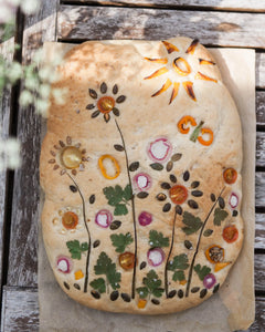 Honeywell Bakes Garden Focaccia Bread Baking Kit - Baked bread with floral designs on a wooden surface