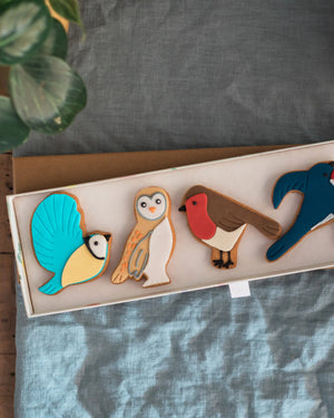 Honeywell Bakes Great British Birds Biscuit Gift - Set of colourful animal-shaped cookies on a tray with a grey background