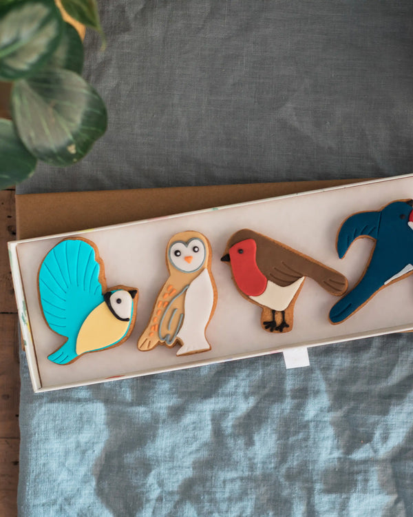 Honeywell Bakes Great British Birds Biscuit Gift - Set of colourful animal-shaped cookies on a tray with a grey background