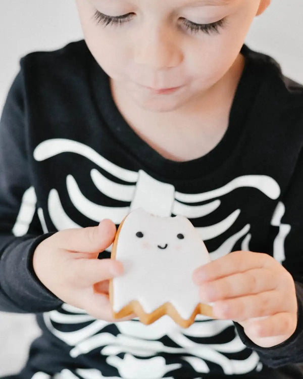 Honeywell Bakes Halloween Biscuit Gift Set - Child holding a small ghost biscuit