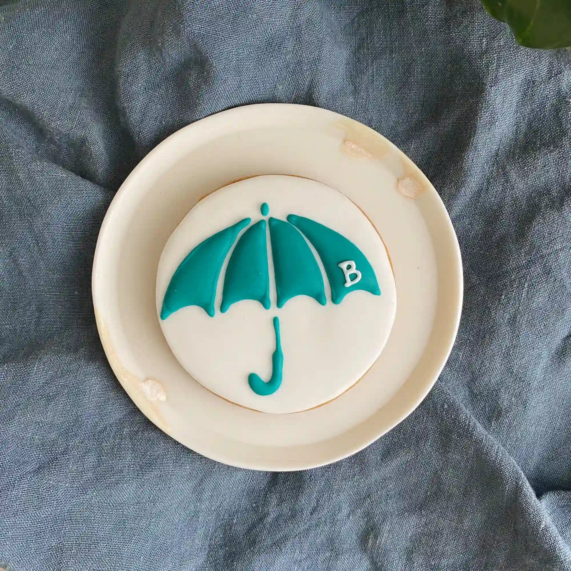 Honeywell Bakes hand iced umbrella logo biscuit for law firm corporate gifting