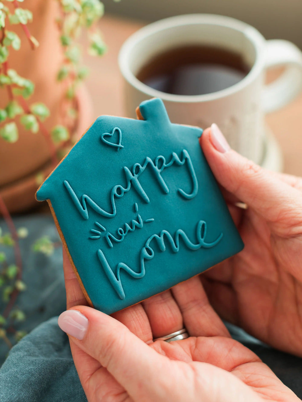 Honeywell Bakes Happy New Home Biscuit - blue biscuit embossed with a ‘Happy New Home’ design