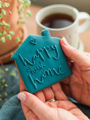 Honeywell Bakes Happy New Home Biscuit - blue biscuit embossed with a ‘Happy New Home’ design