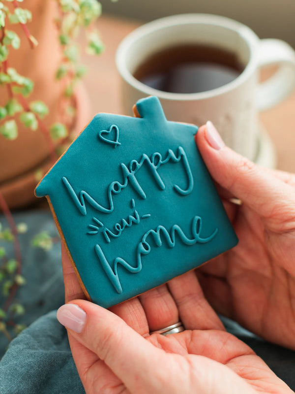 Honeywell Bakes Happy New Home Biscuit - blue biscuit embossed with a ‘Happy New Home’ design