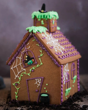 Honeywell Bakes Haunted Gingerbread House Baking Kit - Halloween-themed gingerbread house with decorative elements on a dark background