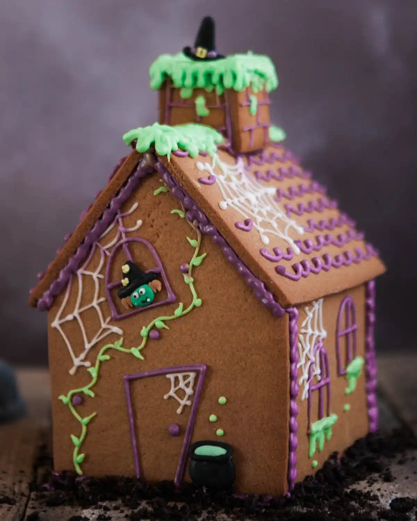 Honeywell Bakes Haunted Gingerbread House Baking Kit - Halloween-themed gingerbread house with decorative elements on a dark background
