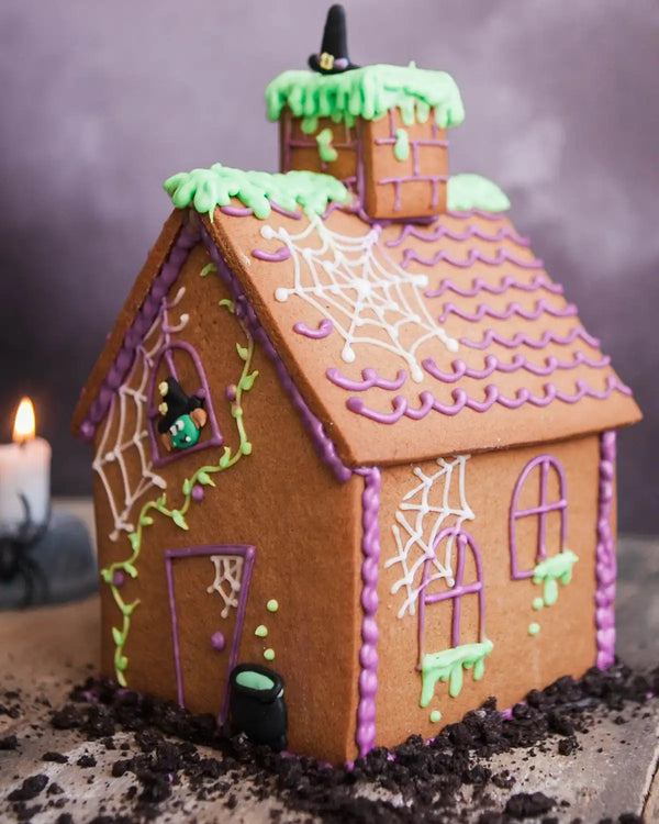 Honeywell Bakes Haunted Gingerbread House Baking Kit - Halloween-themed gingerbread house with decorative elements on a dark background