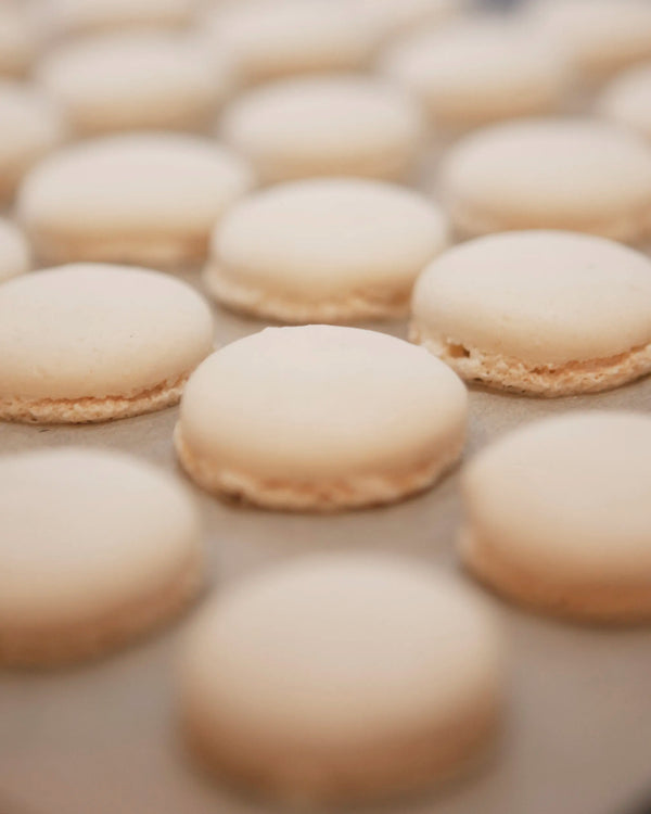 Honeywell Bakes Close-up of beige macarons on a surface
