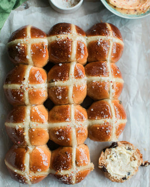 Honeywell Bakes Bread Bakers Subscription, golden brown freshly baked hot cross buns on parchment paper