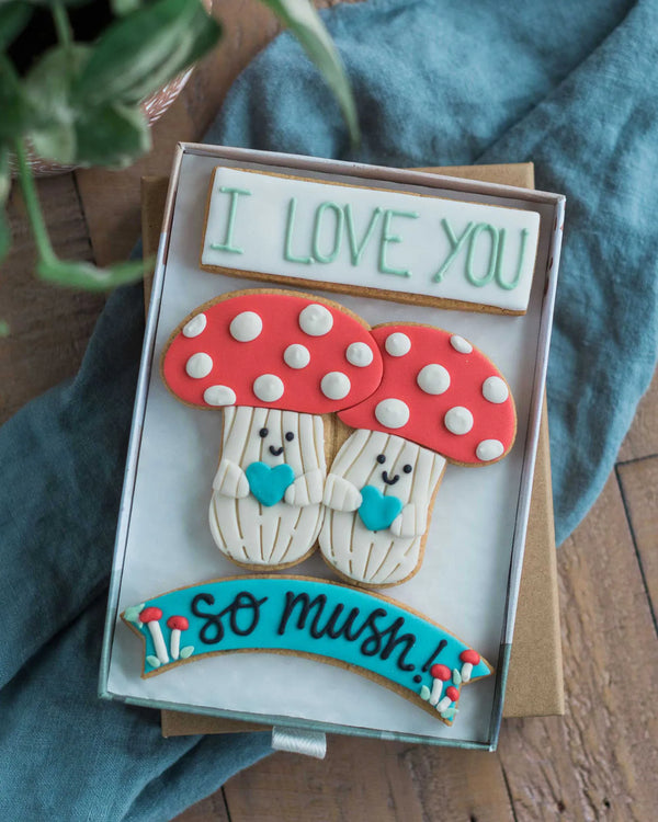 Honeywell Bakes I Love You So Mush - Decorative cookies shaped like mushrooms with 'I LOVE YOU' and 'so mush!' text hand piped on biscuits.