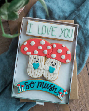 Honeywell Bakes I Love You So Mush - Decorative cookies shaped like mushrooms with 'I LOVE YOU' and 'so mush!' text hand piped on biscuits.