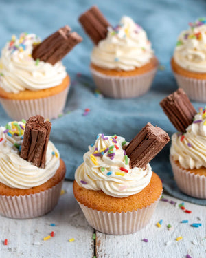 Honeywell Bakes Young Bakers Subscription, Five ice cream cupcakes with white whipped icing, colourful sprinkles, and flakes