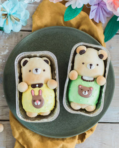 Honeywell Bakes Iced Teddy Bear Loaf Baking Kit - Two bear-shaped buns, iced with a decorative spring theme with flowers and a yellow fabric.