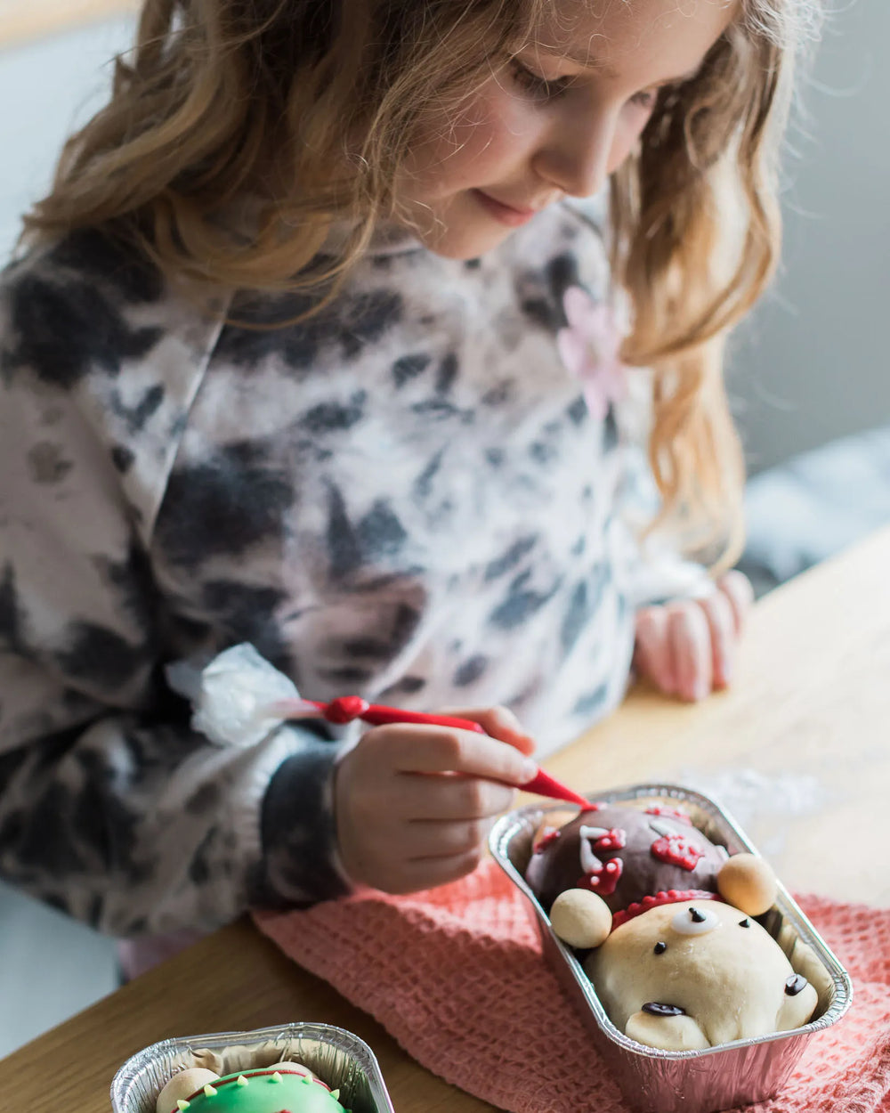 Honeywell Bakes Iced Teddy Bear Loaf Baking Kit - Two bear-shaped buns, iced with a decorative spring theme with flowers and a yellow fabric.