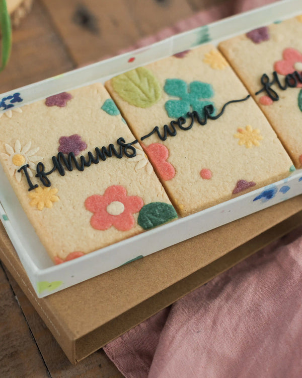 Honeywell Bakes If Mums Were Flowers Biscuit Gift Set - Decorative cookies with floral designs and text on a box.