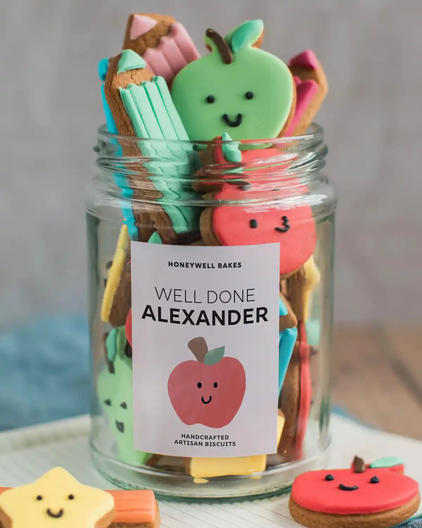 Honeywell Bakes Jar Of Smart Cookies - Jar of colorful cookies with a 'Well Done Alexander' label on a neutral background