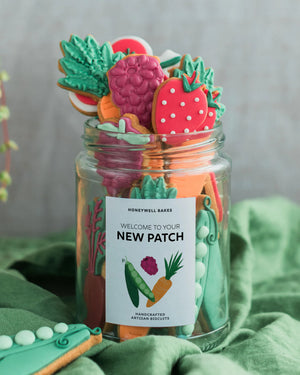 Honeywell Bakes Jar of colourful cookies with a personalised label on a green fabric background