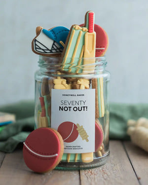 Honeywell Bakes Jar of Cricket Biscuit Gift - Jar of cricket-themed cookies with a decorative label on a wooden surface.