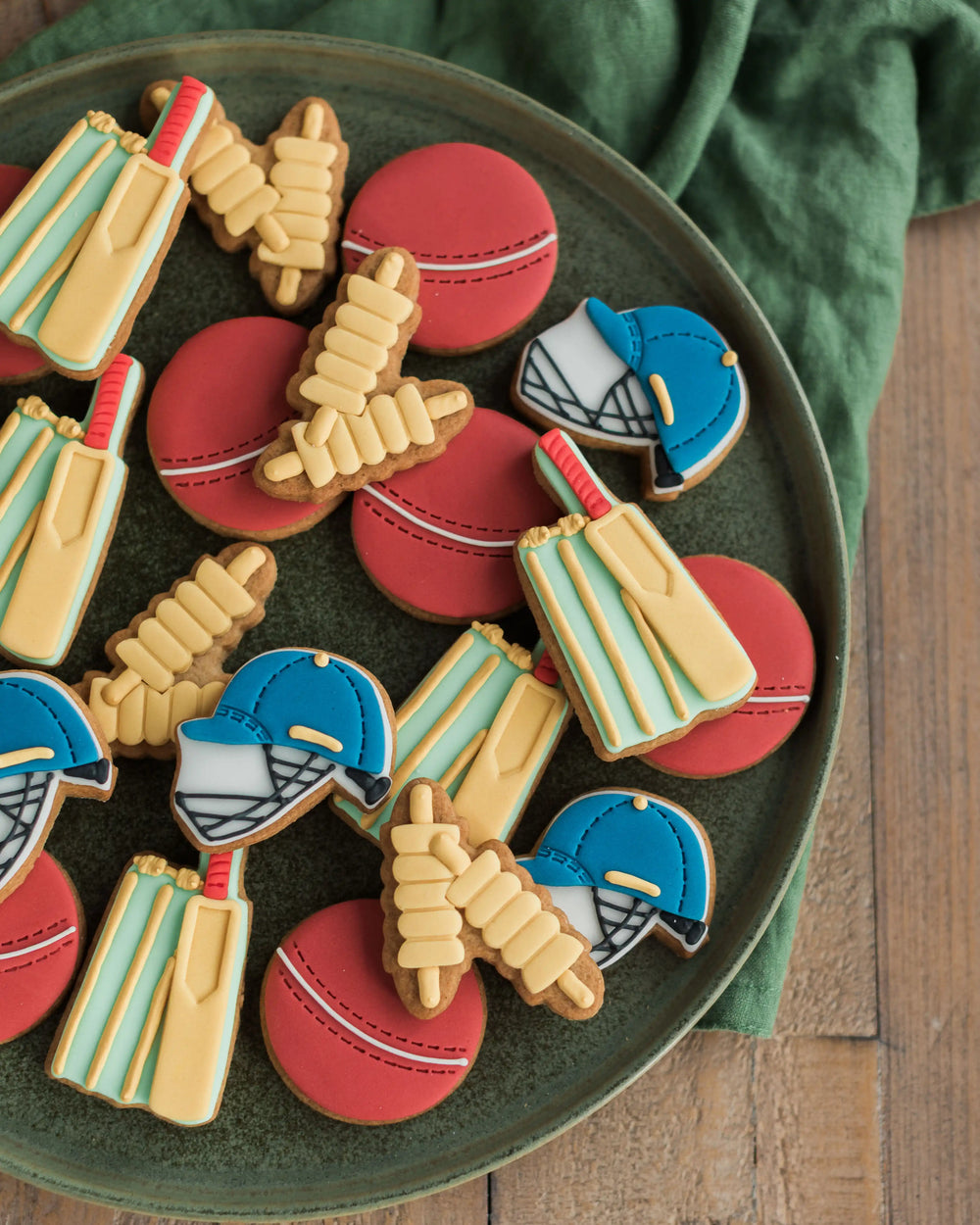 Honeywell Bakes Jar of Cricket Biscuit Gift - Jar of cookies with sports-themed shapes and a personalised label on a wooden surface.