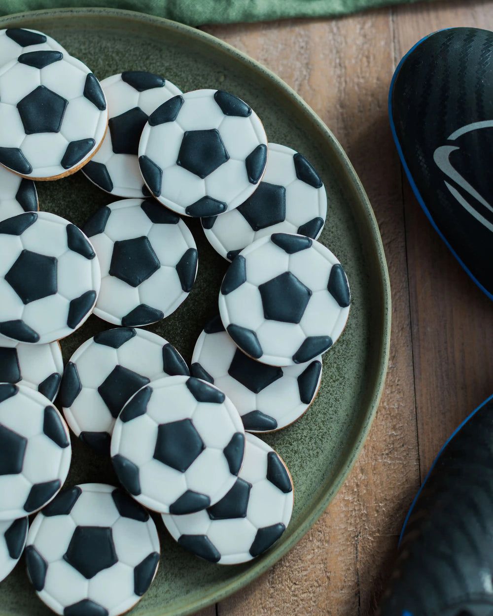 Honeywell Bakes Jar of Football Biscuits - Jar of football-shaped cookies with a 'Football Mad Dad' label on a wooden surface.