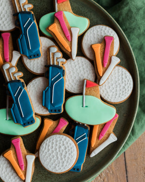 Honeywell Bakes Jar of Golf Biscuit Gift - Golf-themed cookies on a plate with green background