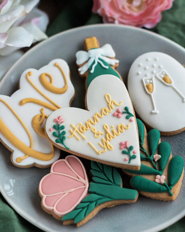 Honeywell Bakes Large Lovely Couple Biscuit Gift Set - Decorative cookies with floral and heart designs on a gray plate.