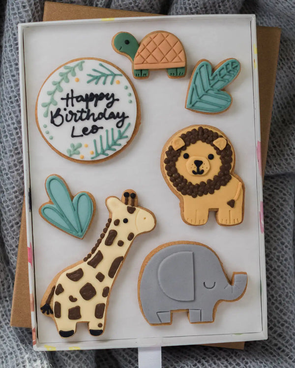 Honeywell Bakes Large Personalised Safari Biscuit Gift - Decorative card with animal-themed cookies on a textured surface