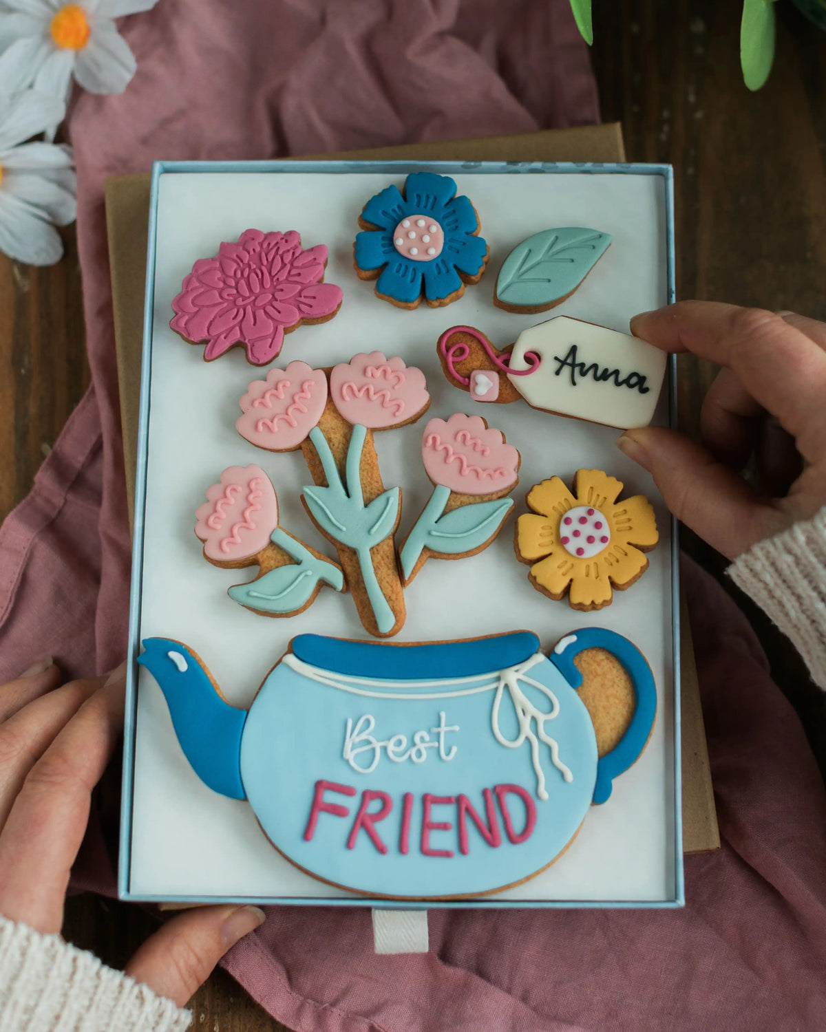 Honeywell Bakes Large Teapot Blooms Biscuit Gift - Gift box with floral cookies and a teapot design, held by hands.