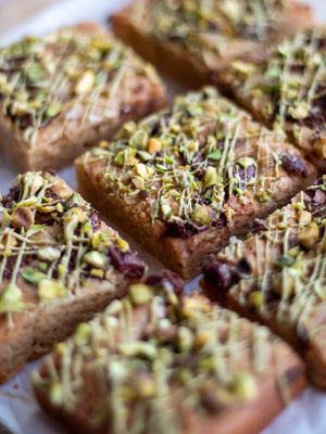 Honeywell Bakes Limited Edition Brown Butter Pistachio Blondies - squares of blondies with a pistachio and chocolate topping
