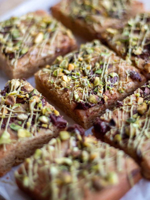 Honeywell Bakes Limited Edition Brown Butter Pistachio Blondies - squares of blondies with a pistachio and chocolate topping