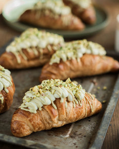 Honeywell Bakes Make Your Own Pistachio Croissant Baking Kit - Croissants with pistachio buttercream filling on a baking tray
