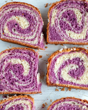 Honeywell Bakes Bread Bakers Subscription, Slices of a purple and white marble bread, showing the spiral pattern of the two colours and a golden brown crust.