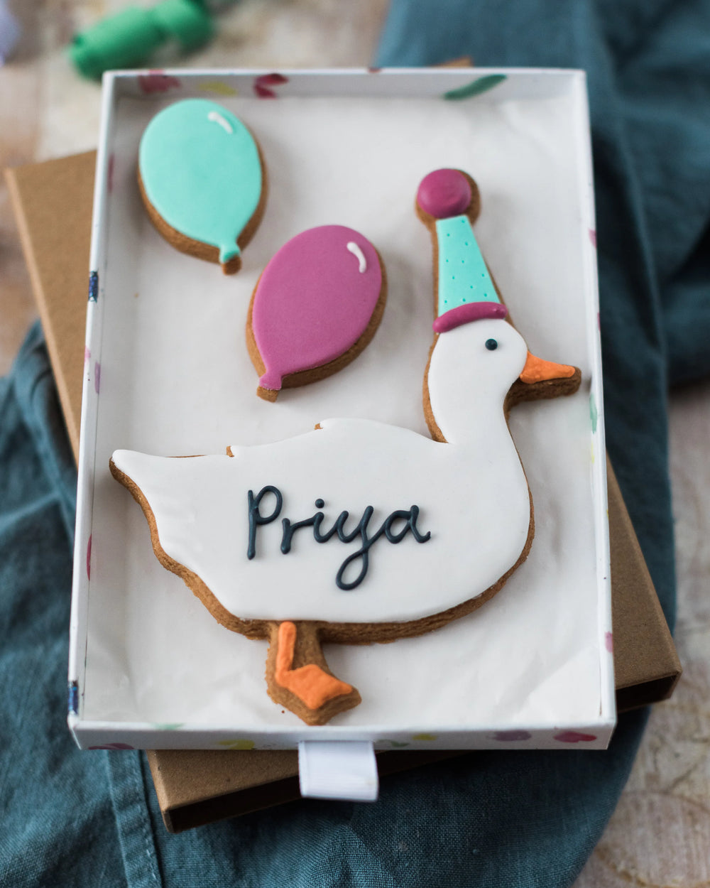 Honeywell Bakes Medium Party Duck Biscuit Gift - Decorative cookie shaped like a duck with balloons in a gift box