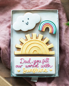 Honeywell Bakes - Medium You Fill Our World With Sunshine Biscuit Gift - Pretty cookies decorated like a sunshine, rainbow and cloud with a personalised message